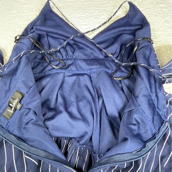 🔥Lulus Ruffle & Flow Black Striped Backless Ruffle
Romper Blue White - Picture 10 of 16